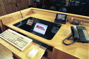 A custom designed lectern with recessed monitors and user interfaces.  Not seen are the computers and related equipment located below the monitors.
